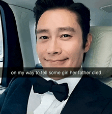 a man in a suit and bow tie is sitting in a car with the caption on my way to tell some girl