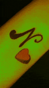 the letter a is on a green background