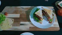 a sandwich on a plate with a toothpick that has the letter a on it