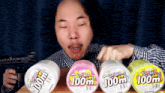 a bald man with a wig and mustache is eating three containers of 100m toothpaste