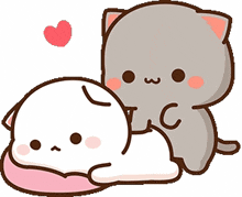 a gray cat is petting a white cat laying on a pink pillow .