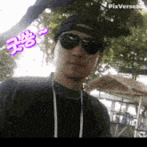 a man wearing sunglasses and a baseball cap has pixverse.com written on the bottom right
