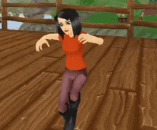 a girl in a red shirt is standing on a wooden floor with her arms outstretched
