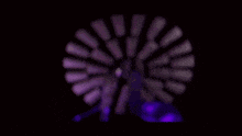 a close up of a purple light in a dark room .