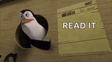 a penguin is standing next to a piece of paper that says read it on it