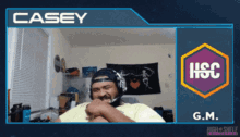 a man wearing headphones with the name casey on the top left