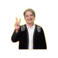 a woman in a black jacket and white shirt is giving the peace sign
