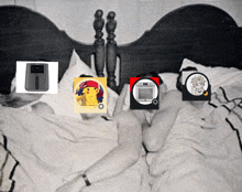 a black and white photo of two people laying in bed