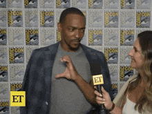 a man is being interviewed at comic con