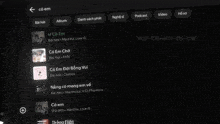 a screen shows a list of songs including li co em and chillies