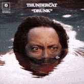 the album cover for thundercat 's " drunk " features a man swimming in the water