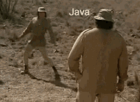 a man in a hat is standing in the dirt in a field .