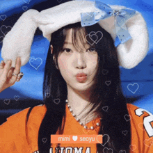 a girl wearing a bunny hat with hearts around her and the name mimi on the bottom