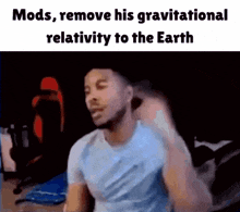 a man is sitting in front of a computer with the caption mods remove his gravitational relativeity to the earth