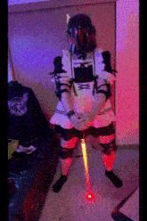a man in a maid costume holding a light saber
