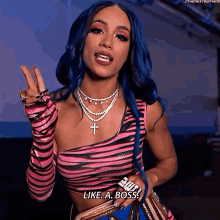 a woman with blue hair is wearing a zebra print top and gloves and says " like a boss "