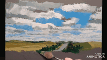 a person is painting a landscape with the words made in animotica on the bottom
