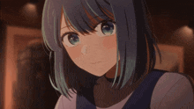 a girl with blue hair is looking at the camera