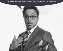 a man in a suit and tie with a speech bubble that says it 's the same but translated in romanian