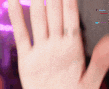 a person 's hand is visible in front of a screen that says kingdo