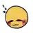 a yellow smiley face is sleeping with its eyes closed and a red spot on its cheek .