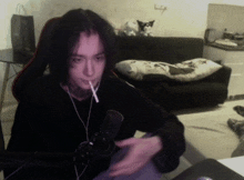 a person smoking a cigarette while wearing headphones