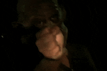 a close up of a person 's hand reaching out