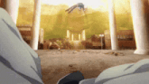 a person is sitting in front of a building with a bird flying in the air .