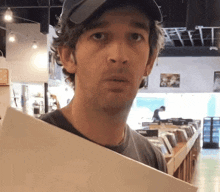 a man holding a piece of paper in front of a sign that says soul on it