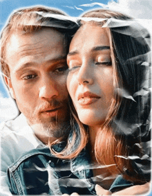 a man and a woman with their eyes closed are behind a piece of paper