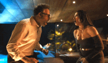 a man and a woman are standing next to each other
