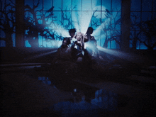 a group of women are laying on the floor in front of a window with trees in the background