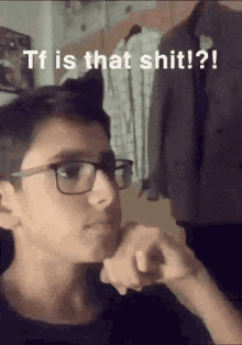 a young man wearing glasses says " tf is that shit "