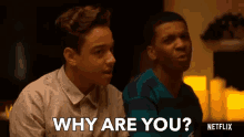 two young men are sitting next to each other and one of them says why are you