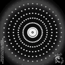 a circle of white dots on a black background with the year 2003