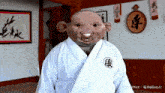 a cartoon character wearing a white robe with chinese characters on the sleeves