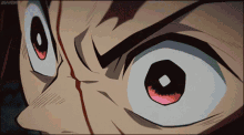 a close up of a cartoon character 's eyes with the word anime on the bottom right