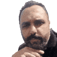 a man with a beard and mustache is looking at the camera