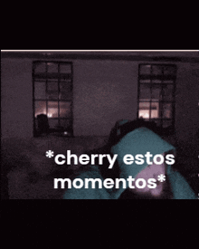 a man with a beard is wearing a green hoodie and headphones and says cherry estos momentos