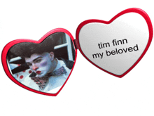 a heart shaped mirror with the words tim finn my beloved