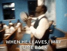 a man is dancing in a room with the words `` when he leaves , i may come back '' written below him .