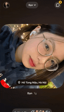 a picture of a girl with glasses is displayed on the screen