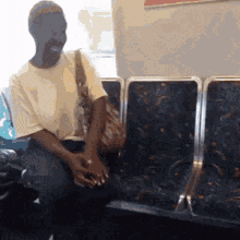 black lady talking to herself on subway tee lady talking to herself