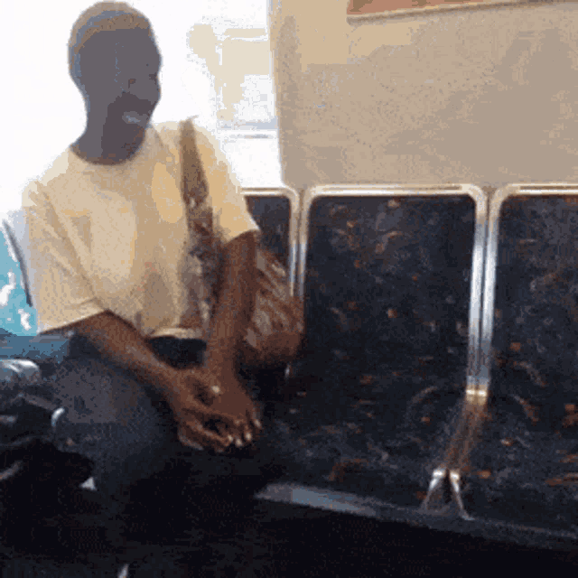 black-lady-talking-to-herself-on-subway-