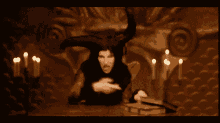 a pixelated image of a man with horns sitting at a table