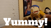 a puppet with the word yummy written on it