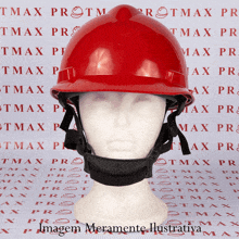 a red hard hat is on a mannequin in front of a wall with tmax written on it