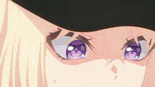 a close up of a girl 's face with purple eyes and a black hat