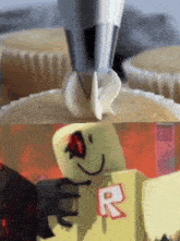 a picture of a cupcake being frosted and a picture of a roblox character with the letter r on it