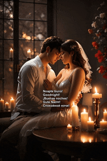 a bride and groom are kissing in front of candles and a window